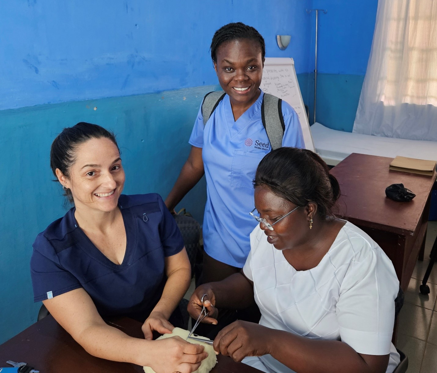 Nurse Fellow Caroline Regelous, along with Seed Educator Chrisencia Owoko, working with midwifery preceptors on suturing techniques, October 2023.