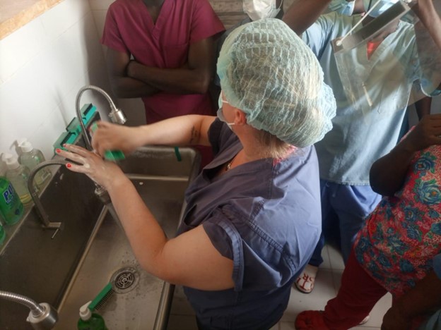 Nurse Fellow Kristen Urbanek teaches Operating Room clinical staff handwashing techniques in Harper, Liberia, March 2025