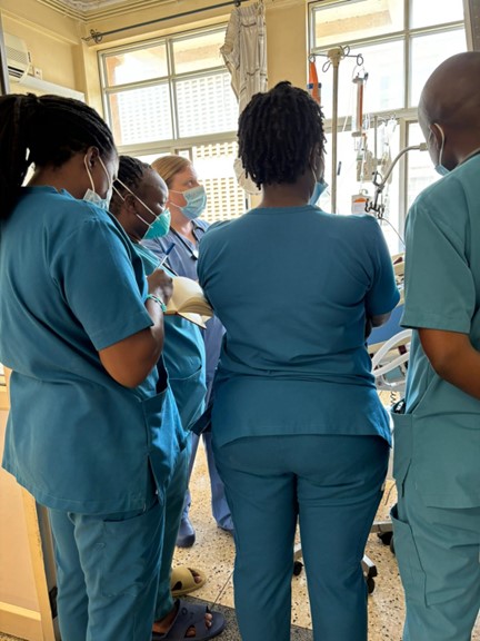 Nurse Fellow Meghan Crann working with Master of Science in Critical Care nursing students at Mbarara Regional Referral Hospital Intensive Care Unit, April 2024