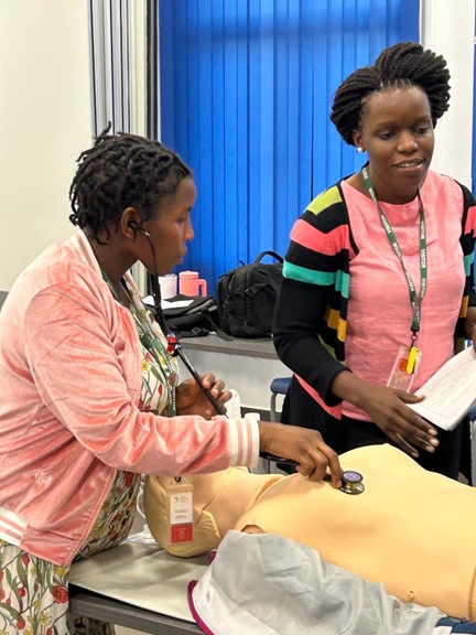 Josephine Najjuma, MSN, RN, facilitating simulation with nurses during the Trauma Nursing Fundamentals training at University of Global Health Equity in Butaro, Rwanda.