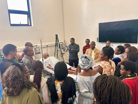 Nurses from Butaro Level Two Teaching Hospitals participate in simulation during the Trauma Nursing Fundamentals course in Butaro, Rwanda, March 2025